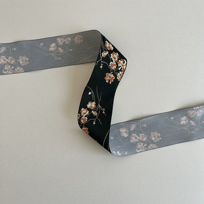 Single-sided white ribbon with gray floral print, subtle vintage craft ribbon suitable for floral and gift projects