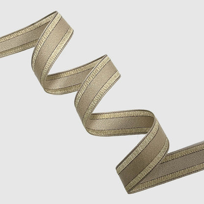 Ivory champagne wired ribbon folded in crisp zigzag showing light warm tone and wire-edged structure — Sivonna bow making ribbon