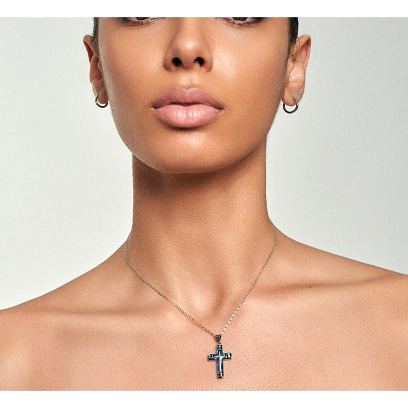 Model wearing Abalone Shell Mosaic Cross Pendant Necklace in silver, front-facing neckline close-up — iridescent shell cross pendant by Sivonna