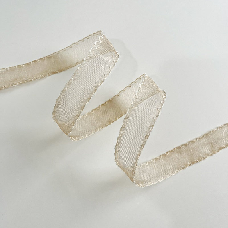 Ivory floral print scallop edge sheer ribbon showing botanical pattern on translucent ground with scalloped border — Sivonna sheer craft ribbon