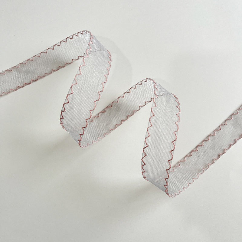 Butter yellow scallop edge sheer ribbon with warm pale tone showing scallop stitch detail on both edges — Sivonna spring gift wrapping ribbon