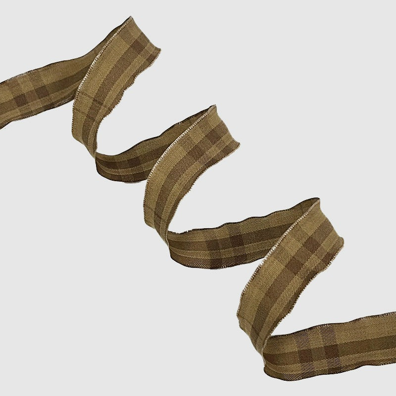 Espresso dark brown wired ribbon folded in crisp zigzag showing near-black warm tone — Sivonna wired ribbon for wreaths