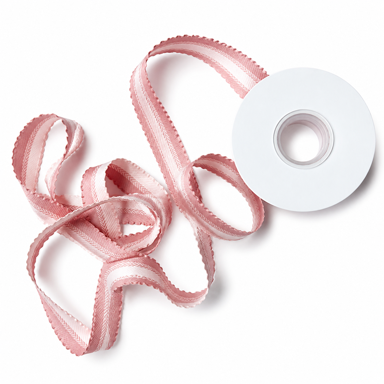 Dusty rose satin and sheer ribbons curled into soft decorative loops on white spool — Sivonna gift wrapping ribbon